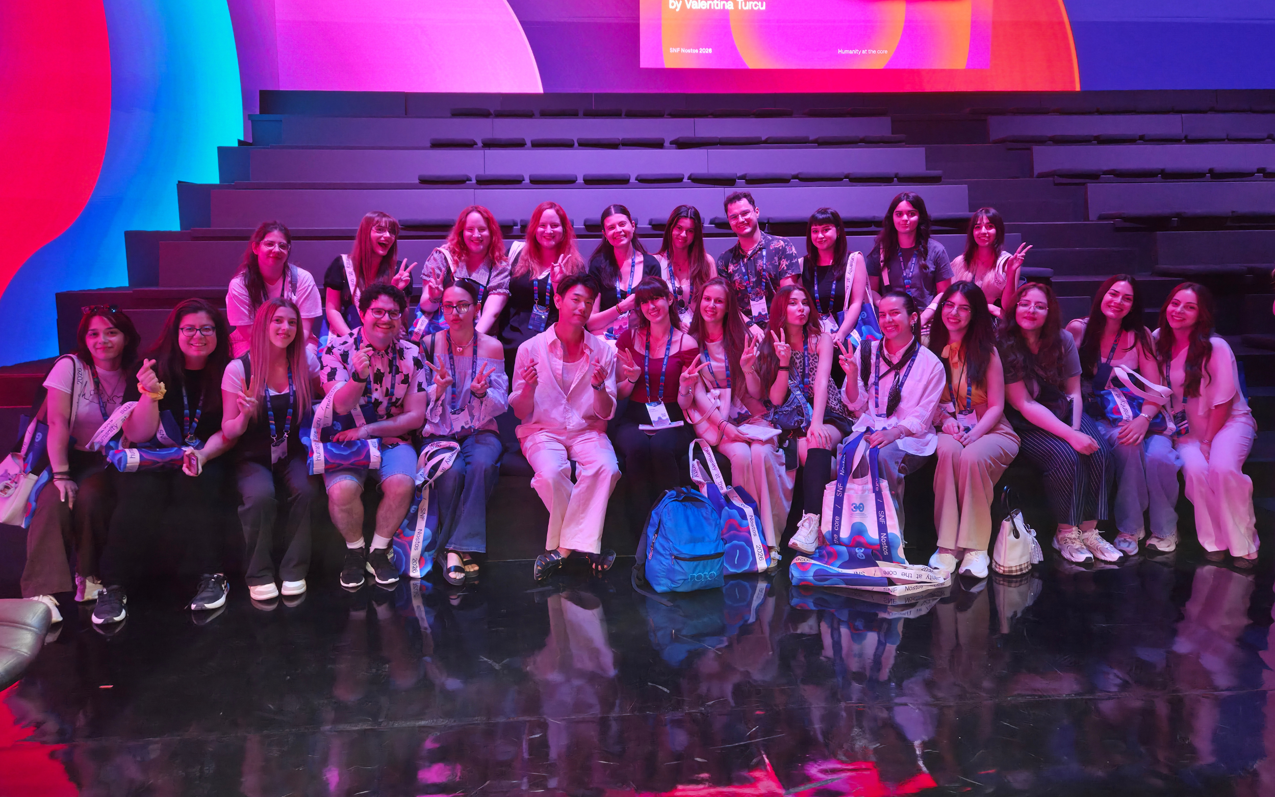 Eric Nam takes a group photo with attendees after the “Resonant Voices: Culture, Creators and Youth Mental Health” panel during SNF Nostos 2026 on June 22 in Athens (by koreaculture.gr)